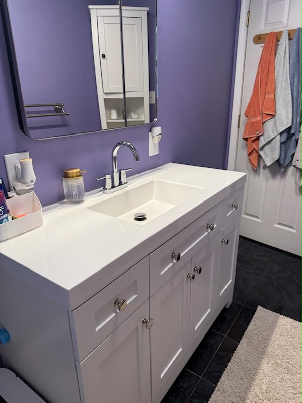 Polished bathroom sink and chrome fixtures